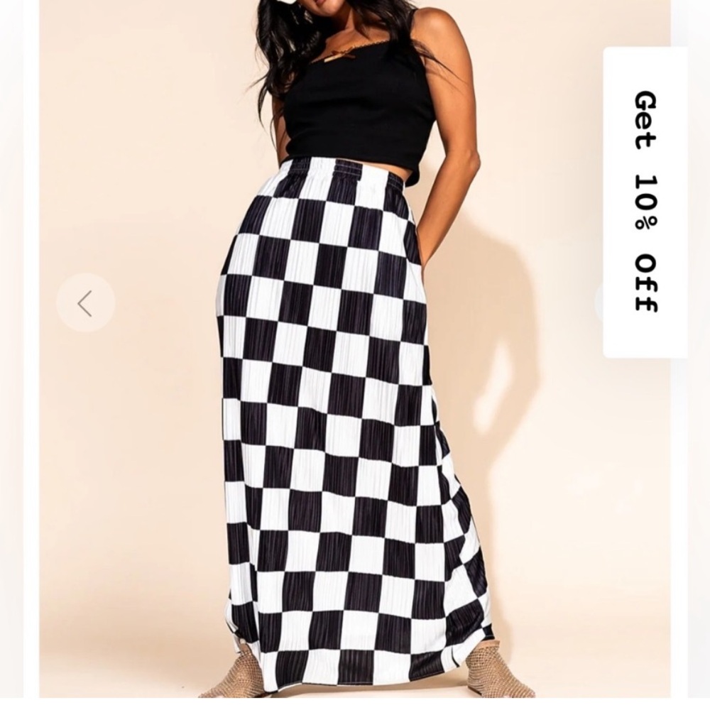 Dressed in LALaA checkered skirt.